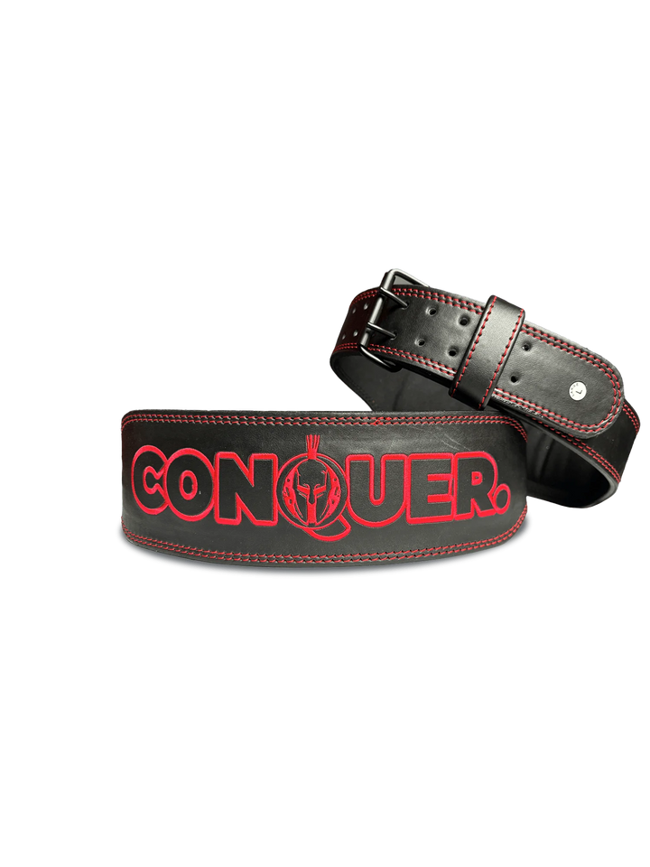 A striking red conquer belt, symbolizing strength and victory, elegantly displayed against a neutral background.