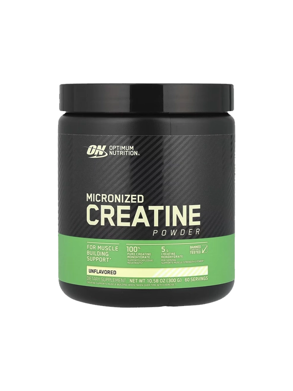 Micronised Creatine powder displayed in a scoop, emphasizing its role as a protein supplement for athletic performance.