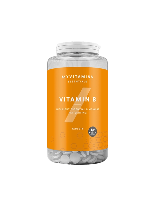 Yellow Vitamin B tablets on a clean surface